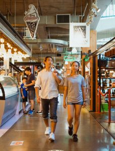 couple walking in indoor market