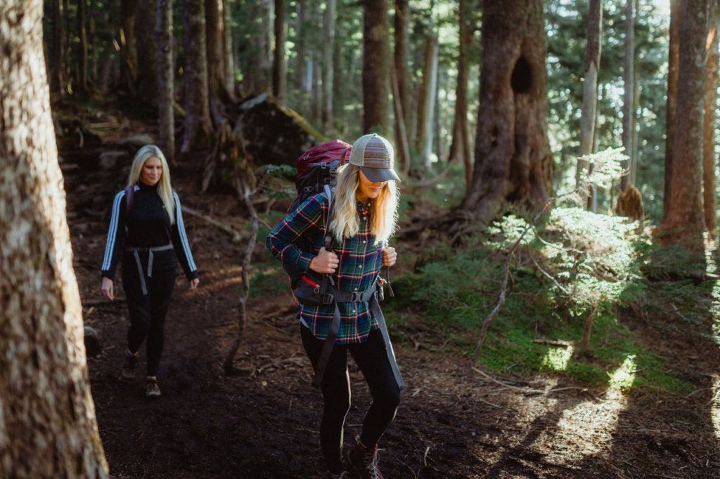 Two women hiking in forest