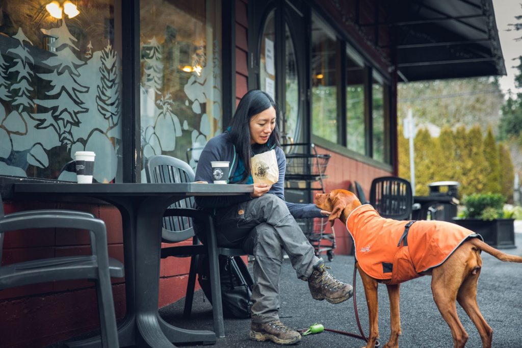 Woman and dog outside end of the line general store